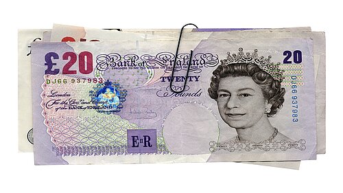 Multiple fifty pound notes.
