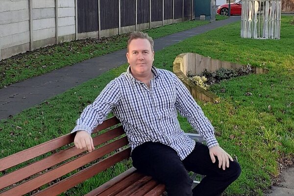 Chris Jones, PPC for Redcar (and Saltburn), sat on a bench.