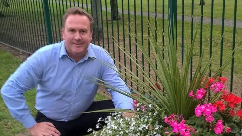 Chris Jones and flower planters in his Council Ward of West Dyke.