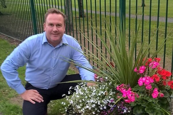 Chris Jones, PPC for Redcar (and Saltburn), with a flower planter in West Dyke Ward, which he created himself in his role as Councillor and as a Community Champion.